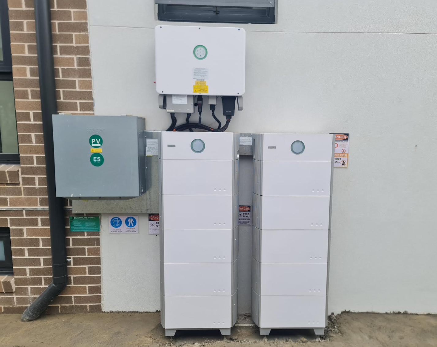 Twin batteries and hybrid inverter installed with neat conduit and isolators